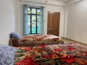 Postel nebo postele na pokoji v ubytování Woods Homestay