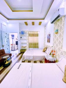 Ένα ή περισσότερα κρεβάτια σε δωμάτιο στο Hoàng Nga Apartment Phan Thiết +63 φωτογραφίες