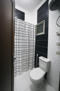 Koupelna v ubytování CozyQ Apt