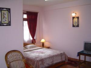 Postel nebo postele na pokoji v ubytování Deki Lodge