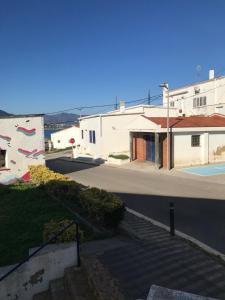 a view of a street with buildings and a road at La Musclera L5, apartament aprop de la platja del Pas in Port de la Selva