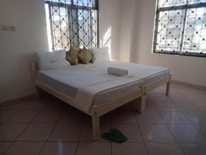 Ένα ή περισσότερα κρεβάτια σε δωμάτιο στο Fully Furnished rooms in an apartment near down town TF1