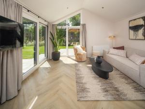 TV a/nebo společenská místnost v ubytování Veluwepark de Bosgraaf