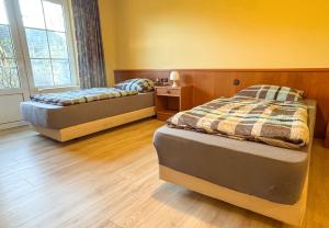 Postel nebo postele na pokoji v ubytování 33 - 4 Hotelkamer voor 2 gasten op de begane grond