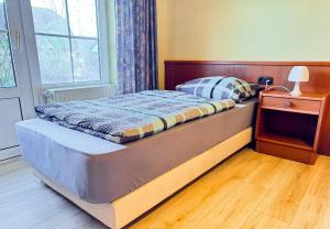 Postel nebo postele na pokoji v ubytování 33 - 4 Hotelkamer voor 2 gasten op de begane grond + 8 fotografií