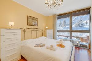 Ένα ή περισσότερα κρεβάτια σε δωμάτιο στο Appartamento Tracce Di Neve - Happy Rentals