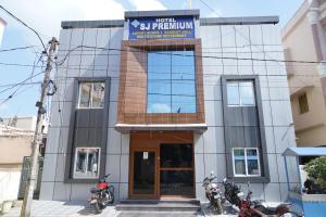 a building with motorcycles parked in front of it at HOTEL SJ PREMIUM in Bhubaneshwar