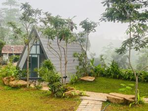 a small house in the middle of a forest at Rain Drops Wellness Villa Deniyaya, Sinharaja in Deniyaya