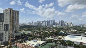 a view of a city with tall buildings at City View with Balcony at Kasara Residences C5 Pasig in Manila