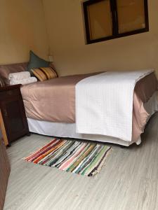 Ένα ή περισσότερα κρεβάτια σε δωμάτιο στο Sunwich Beach Home