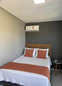 Postel nebo postele na pokoji v ubytování Refugio Moderno com Piscina Quente e Por do Sol