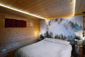 Postel nebo postele na pokoji v ubytování Dolomiti Urban Lodge