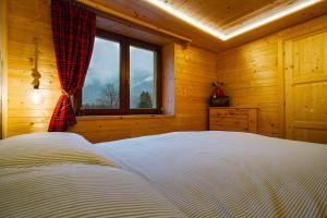 Postel nebo postele na pokoji v ubytování Dolomiti Urban Lodge