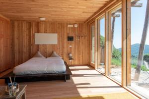 Ένα ή περισσότερα κρεβάτια σε δωμάτιο στο Borgata Paraloup