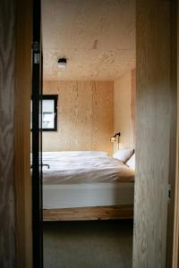 Ένα ή περισσότερα κρεβάτια σε δωμάτιο στο Dream Cabin With Danish Design And Views