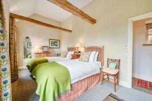Ένα ή περισσότερα κρεβάτια σε δωμάτιο στο Bullfinches Barn