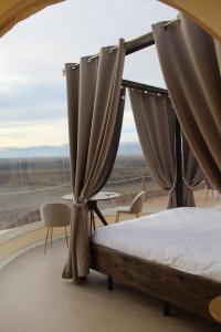 Postel nebo postele na pokoji v ubytování Wine Bubble