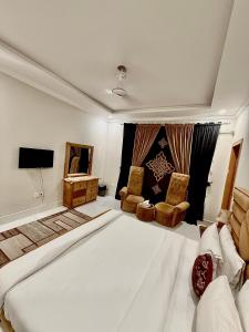 Ένα ή περισσότερα κρεβάτια σε δωμάτιο στο Paradise Guest House Islamabad