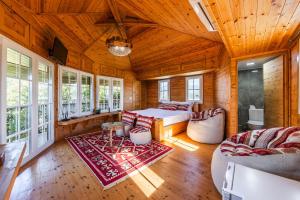 a bedroom with a bed in a wooden room at The Animals Farm Double Room in Tirana