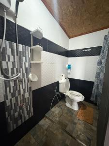 a bathroom with a toilet and a shower at Krabi Nemo House in Ao Nang Beach +45 photos