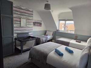 Ένα ή περισσότερα κρεβάτια σε δωμάτιο στο Catch of the Day