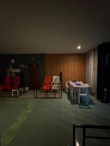 a room with two tables and chairs in it at Krabi Nemo House in Ao Nang Beach