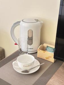 Příslušenství pro přípravu čaje a kávy v ubytování MANDARIN Hotel