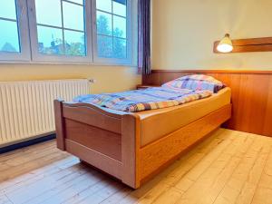 a bedroom with a bed in a room with windows at 33 - 11 Hotelkamer voor twee personen in Marx in Bunkenburg +6 photos