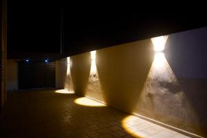 a dark hallway with lights on the wall at Studio Chic in Mahdia +1 photo