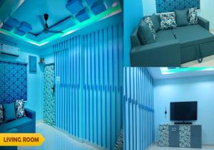 a living room with a couch and a television at PS Pristine Sea View Vacation Home in Bhīmunipatnam