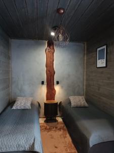 Ένα ή περισσότερα κρεβάτια σε δωμάτιο στο Rusty Reindeer Levi