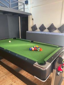 a pool table in a room with a pool table at Dormyy backpackers castle in Guwahati