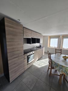 Kuchyň nebo kuchyňský kout v ubytování Le cocon du Bassigny