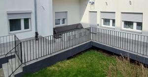 a balcony with a fence in front of a building at Apartament Agat in Lwówek Śląski