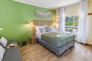 Postel nebo postele na pokoji v ubytování Eretz Zeelim