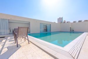 Πισίνα στο ή κοντά στο Royal Palace Compound - Al Mounsiah