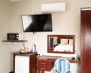 TV a/nebo společenská místnost v ubytování The Executive House