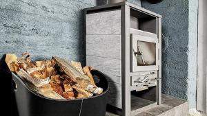 a trash can sitting next to a microwave at Simple Cabin Life In This Nature Cabin in Uvdal