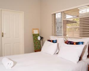 Postel nebo postele na pokoji v ubytování The Executive House