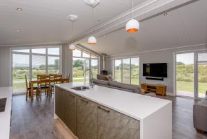 a kitchen and living room with a couch and a table at Landal North Lakes in Brayton Station