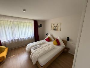 a bedroom with two beds and a window at Haus Anna in Alpirsbach