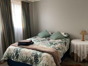 Ένα ή περισσότερα κρεβάτια σε δωμάτιο στο Home away from home