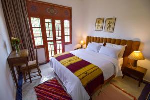 Ένα ή περισσότερα κρεβάτια σε δωμάτιο στο Bluegreen Guest House Marrakech