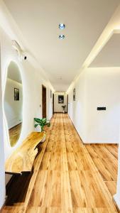 a room with a wooden floor with a wooden log on the floor at Hotel COCODAN in Indore
