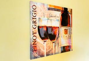 a painting of a bottle and a glass of wine at 33 - 16 Hotelkamer voor twee personen in Bunkenburg