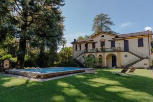 a house with a swimming pool in the yard at La Limonaia - Tremezzo by LoveComo in Tremezzo