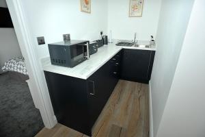 Köök või kööginurk majutusasutuses The Ralph Suite