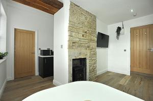 Televiisor ja/või meelelahutuskeskus majutusasutuses The Ralph Suite