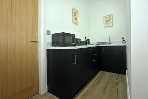 Köök või kööginurk majutusasutuses The Ralph Suite