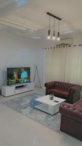 Televiisor ja/või meelelahutuskeskus majutusasutuses Villa sérénité